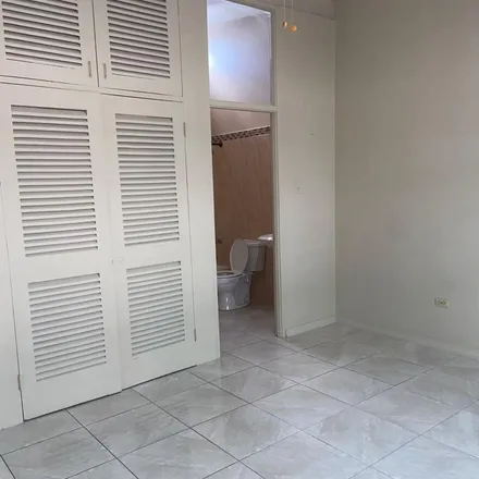 Rent this 2 bed townhouse on Hibiscus Drive in Barbican, Jamaica