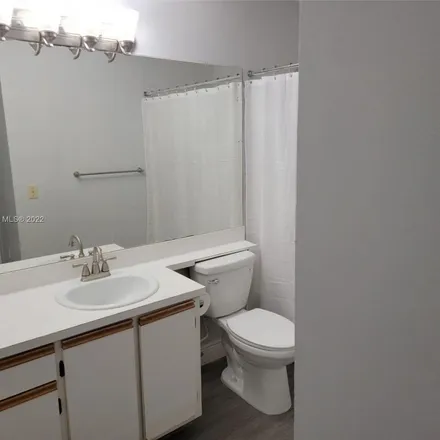 Rent this 2 bed apartment on 18340 Northwest 68th Avenue in Country Club, Miami-Dade County