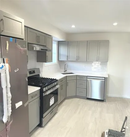 Rent this 3 bed house on 58-11 83rd Street in New York, NY 11379