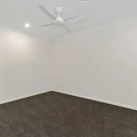 Rent this 4 bed apartment on 9 Pitta Street in Maudsland QLD 4210, Australia