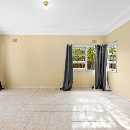 Rent this 3 bed apartment on Glenfield LPO (Local Post Office) in 1 Trafalgar Street, Glenfield NSW 2167