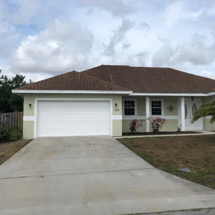 Rent this 3 bed house on 112 Southwest Carter Avenue in Port Saint Lucie, FL 34983