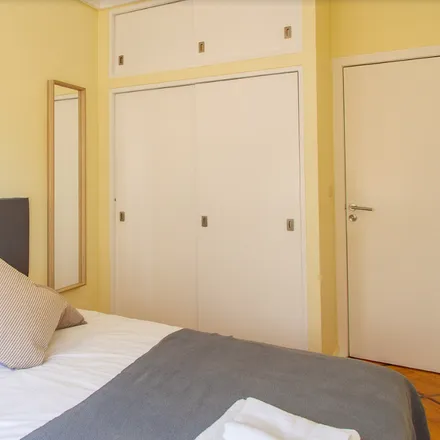 Rent this 6 bed room on Rua António Enes 25 in 1050-114 Lisbon, Portugal