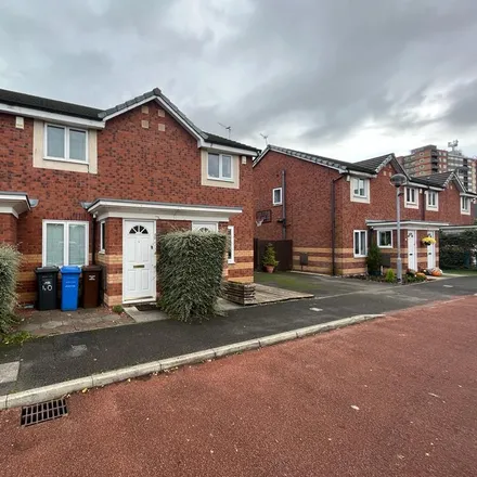 Rent this 2 bed townhouse on 42 Velour Close in Salford, M3 6AP