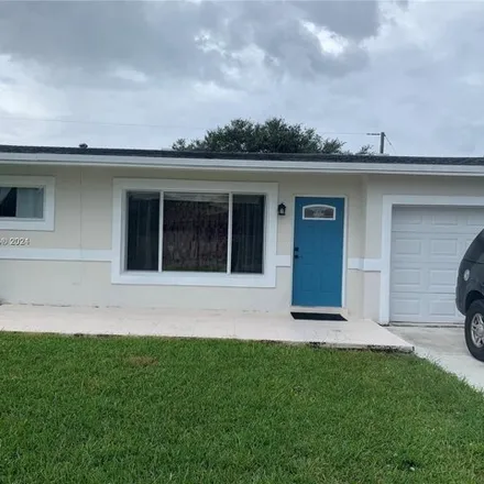 Buy this 2 bed house on 8680 NW 29th St in Sunrise, Florida