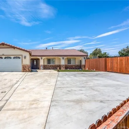 Rent this 4 bed house on 1516 North Ash Avenue in Rialto, CA 92376