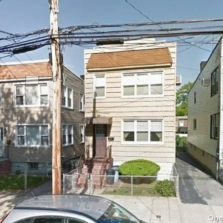 Buy this 4 bed house on 9-13 124th Street in New York, NY 11356