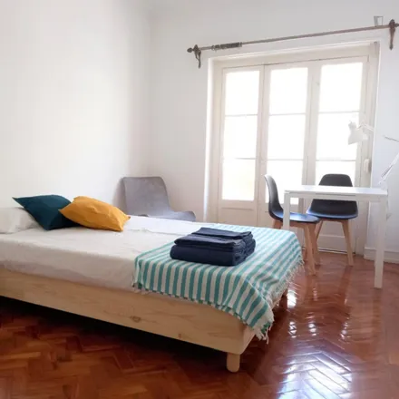 Rent this 3 bed room on Rua de Arroios 85 in 1150-056 Lisbon, Portugal