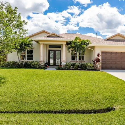 Buy this 4 bed house on 650 Southwest McCullough Avenue in Port Saint Lucie, FL 34953