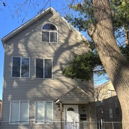 Rent this 3 bed house on 12304 South Emerald Avenue in Chicago, IL 60628