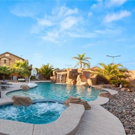 Buy this 4 bed house on 5502 Ashley Creek Street in Summerlin South, NV 89135