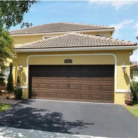 Rent this 4 bed house on 1518 Maple Drive in Weston, FL 33327