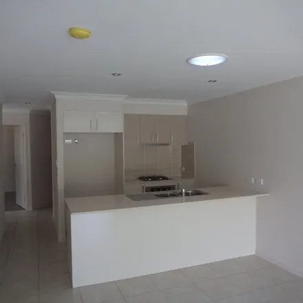 Rent this 3 bed apartment on Rowbotham Street in Rangeville QLD 4250, Australia