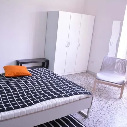 Rent this 6 bed room on Via dei Giudicati 3 in 09131 Cagliari Casteddu/Cagliari, Italy