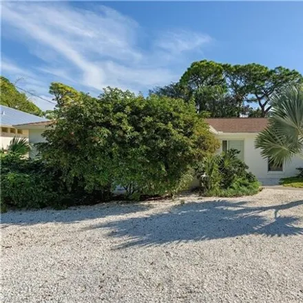 Buy this 3 bed house on 2512 Dawn Circle in Naples, FL 34103