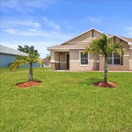 Rent this 3 bed house on 841 Southwest Commonwealth Road in Port Saint Lucie, FL 34953