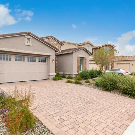 Rent this 4 bed house on 5898 North Milano Court in Maricopa County, AZ 85340