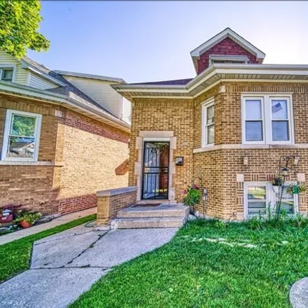 Buy this 3 bed house on 2919 North Lowell Avenue in Chicago, IL 60641