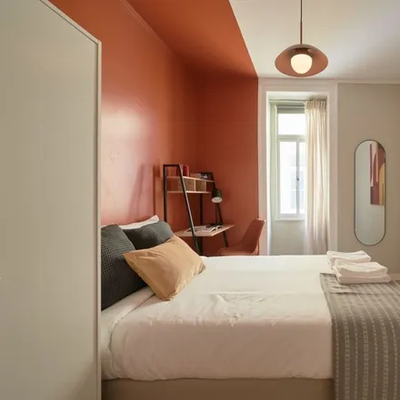 Rent this 12 bed room on Rua Morais Soares