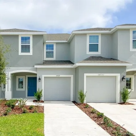 Rent this 3 bed townhouse on Silk Tree Court in Orange County, FL 32862