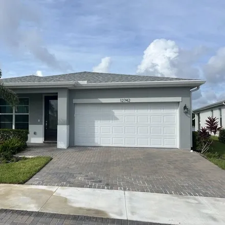 Rent this 3 bed house on 12742 SW Phoenix Dr in Port Saint Lucie, Florida