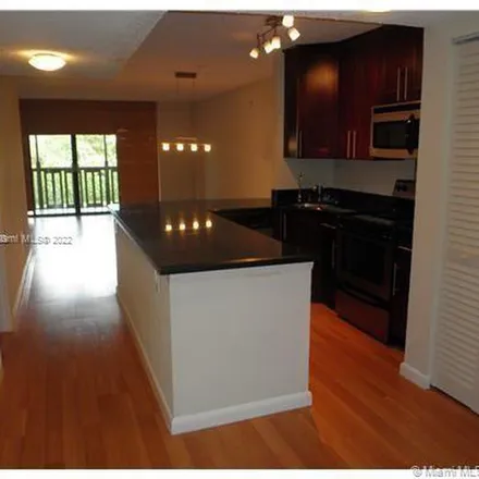 Rent this 2 bed apartment on 950 Mockingbird Lane in Pine Island, FL 33324