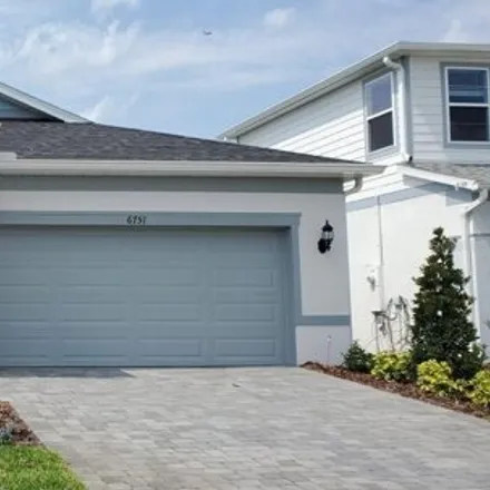 Rent this 4 bed house on unnamed road in Orlando, FL 32829