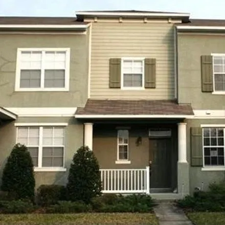 Rent this 3 bed townhouse on Silver Strand Falls Drive in Orange County, FL 32824