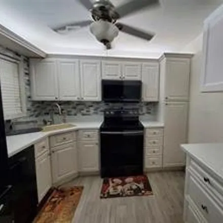 Rent this 3 bed condo on Coconut Creek in FL, US