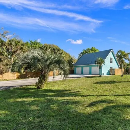 Rent this 3 bed house on 5823 Southwest Savage Avenue in Martin County, FL 34990