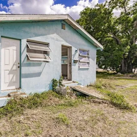 Buy this 3 bed house on 239 Northwest 12th Drive in Belle Glade, FL 33430