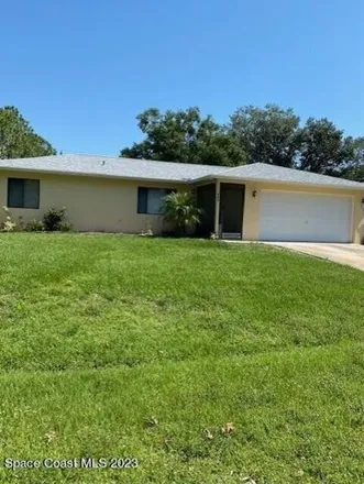 Rent this 3 bed house on 933 Commerce Road Southeast in Palm Bay, FL 32909