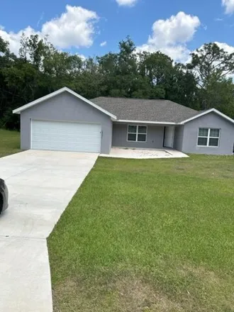 Rent this 3 bed house on 10058 North Athenia Drive in Citrus Springs, FL 34434