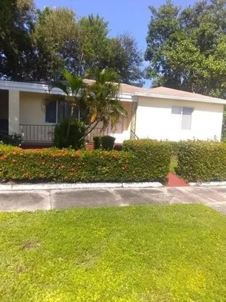 Rent this 3 bed house on 206 Date Palm Drive in Lake Park, Palm Beach County
