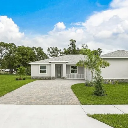 Buy this 4 bed house on Market Circle Northeast in Palm Bay, FL 32905