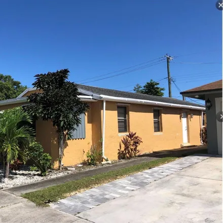 Rent this 4 bed house on 2306 Raleigh Street in Hollywood, FL 33020