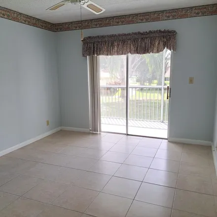 Rent this 2 bed apartment on 400 Village Green Circle West in Palm Springs, FL 33461