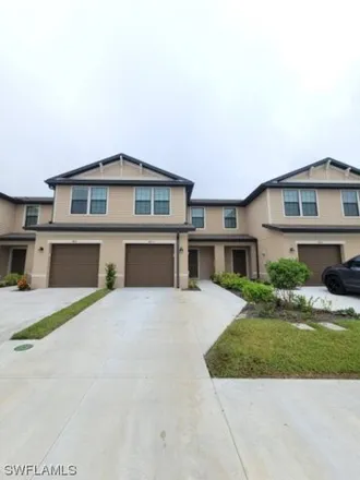 Rent this 3 bed townhouse on Oviedo Place in Lee County, FL