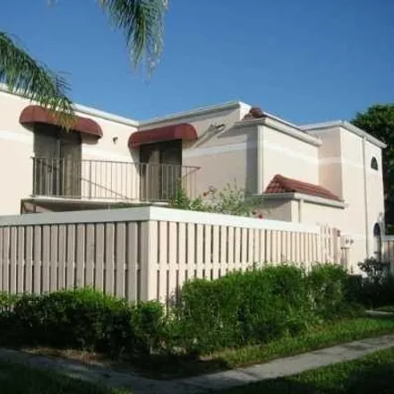 Buy this 3 bed townhouse on 3965 Village Drive in Kingsland, Delray Beach