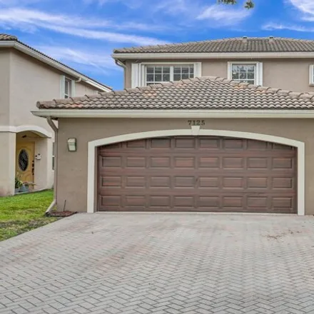 Buy this 4 bed house on 7125 Crescent Creek Way in Coconut Creek, Florida