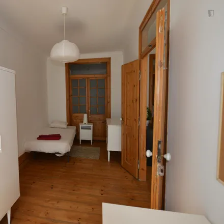 Rent this 4 bed room on Taberna Albricoque in Rua dos Caminhos de Ferro, 1100-108 Lisbon