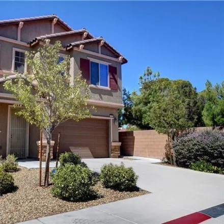 Rent this 4 bed house on 7100 Purple Iris Avenue in Spring Valley, NV 89117