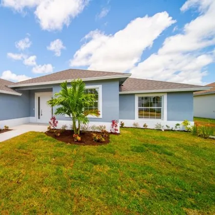 Buy this 4 bed house on 5979 Center Street in Port Saint Lucie, FL 34986