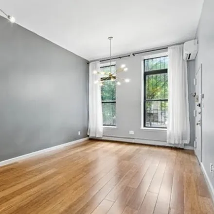 Rent this 3 bed townhouse on 51 West 131st Street in New York, NY 10037