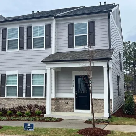 Rent this 3 bed townhouse on Parker Station Avenue in Fuquay-Varina, NC 27526