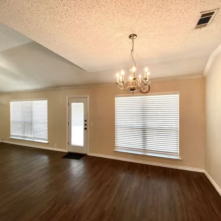 Rent this 3 bed apartment on 9713 Lancashire Drive North in Rowlett, TX 75087