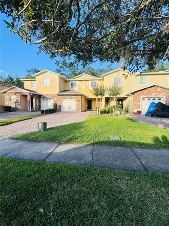 Rent this 3 bed townhouse on 2211 Cypress Villas Drive in Orange County, FL 32825