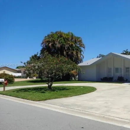 Rent this 3 bed house on 116 Meadowlark Dr in Royal Palm Beach, Florida