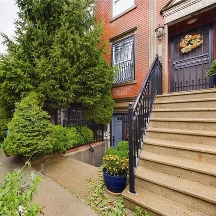 Buy this 5 bed house on 141 Cooper Street in New York, NY 11207
