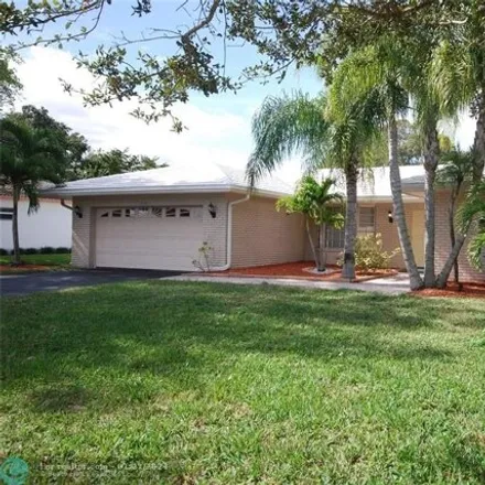 Buy this 4 bed house on 3936 Northwest 106th Drive in Coral Springs, FL 33065